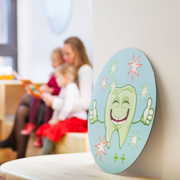 family-in-dentists-waiting-room-picture-of-tooth-2025-04-04-20-58-28-utc